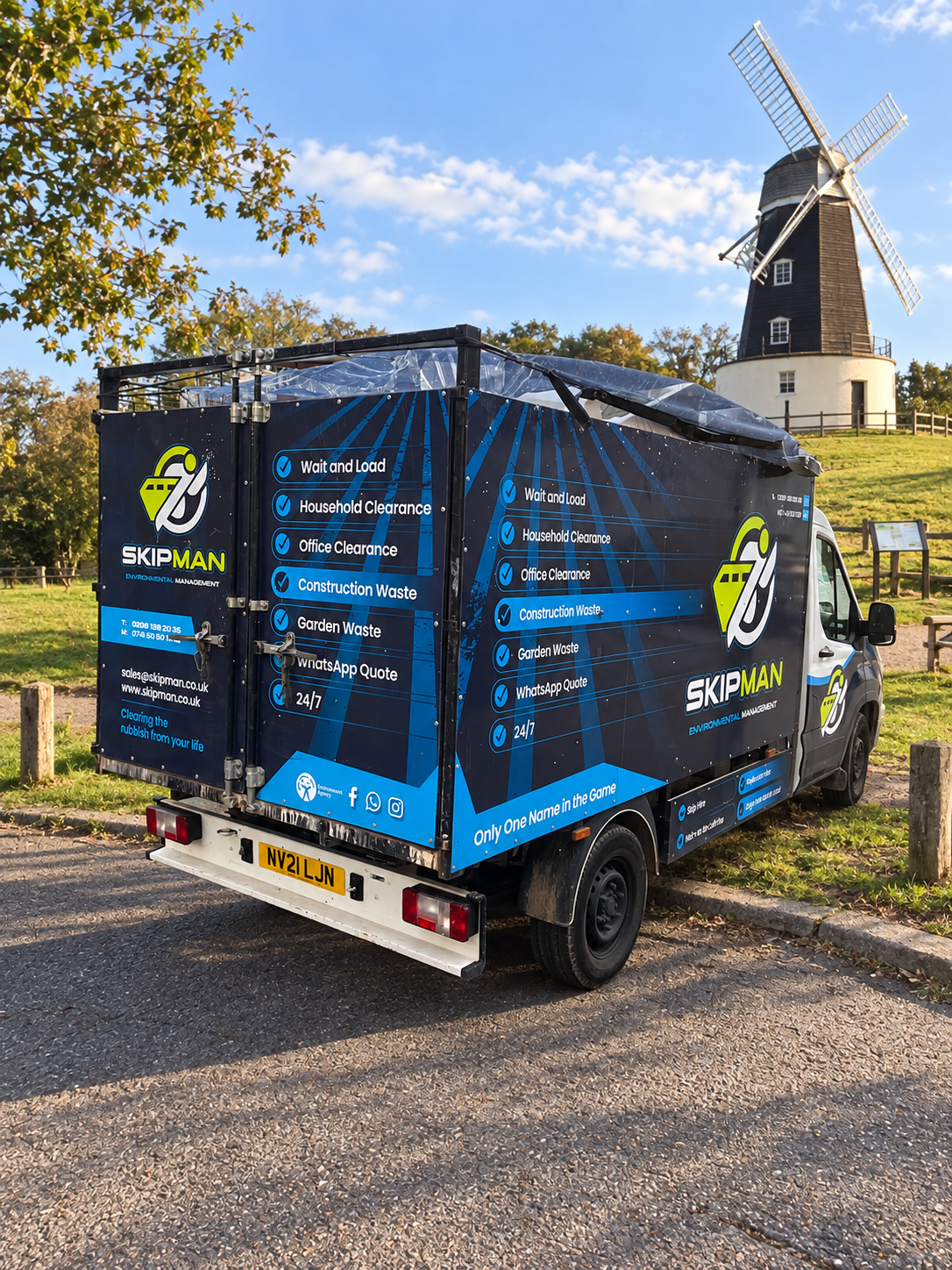 SKIPMAN branded cage van near Horsenden Hill Windmill in Greenford