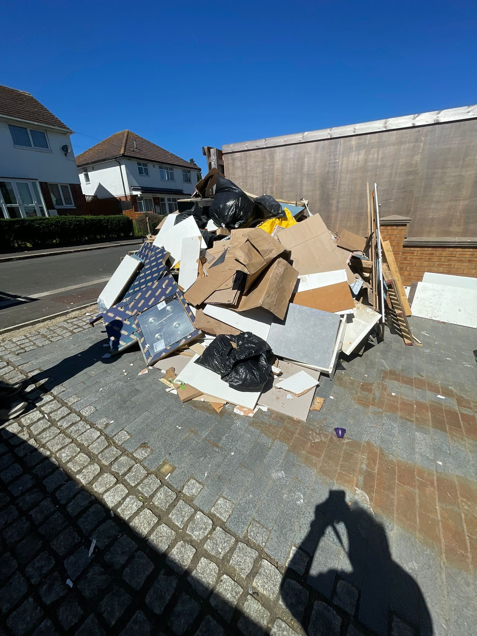Mixed household and building waste ready for collection in Greenford