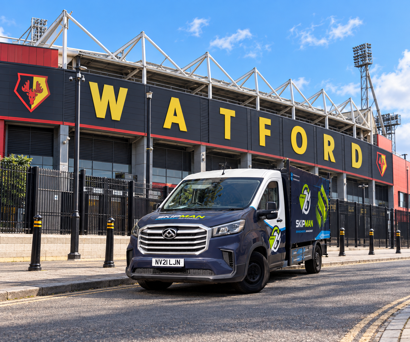 SKIPMAN branded cage van outside Watford football stadium
